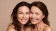 © Oksana_Tukane - Beauty portrait of a senior and young woman with healthy skin. Natural aging skincare concept featuring a smiling mother and daughter for wellness and cosmetic branding.