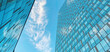 © rohappy - Office building. Skyscrapers in business center. Modern architecture, glass curved facade of residential or commercial real estate, blue sky background