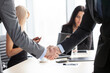 © alotofpeople - businessmen shaking hands in the office