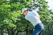 © buritora - A male golfer hitting a tee shot on a golf course (golf swing)