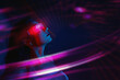© VISTA by Westend61 - Woman using VR set with neon lights in futuristic cyberspace
