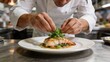 © Evelyn - Professional chef garnishing gourmet fish dish in modern kitchen fine dining culinary art fresh seafood plating restaurant food preparation haute cuisine chef hands white plate
