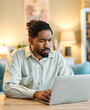 © Lumos sp - Portrait of a young guy or a businessman working from home having a meeting online, home office, or a student learning, or man surfing net shopping or reading