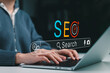 © Sandwish - SEO search and AI optimization Concept. Person using laptop with search bar, target icon, smart tools representing search visibility, keyword strategy, content discovery, digital marketing performance