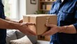© PT88 - Young couple holding cardboard moving box in cozy living room preparing for relocation