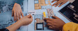 © InfiniteFlow - Engaging image of hands collaborating on interior design by reviewing sketches, color samples, and plans. A dynamic creative workspace illustrates design teamwork. SACTR