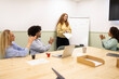 © ADDICTIVE STOCK - Team applauding coworker presenting in modern office