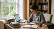 © Vika art - Focused student writing in notebook while studying at home.