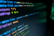 © KANGWANS - Green code glows softly on dark screen.  Code scrolls in vibrant syntax, hinting at deep technical work