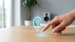 © Chopang.studio - Smart home technology concept with hand adjusting light brightness on wooden table, modern interior background, innovation and convenience