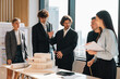 © chokniti - Business team meeting discussion collaboration presenting data analysis corporate teamwork diverse professionals planning strategy office communication partnership