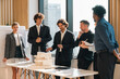 © chokniti - Business professionals discussing ideas in urban setting corporate communication teamwork consultation partnership strategy planning modern workplace collaboration