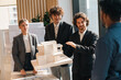 © chokniti - Architect team model meeting office design business plan discussion collaboration Architectural team presenting building model modern office, focused colleagues share creative design idea during