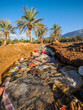 © Marcin Dobas - Plastic waste pollution in irrigation canal Socotra copy space