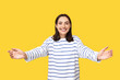 © Pixel-Shot - Young woman opening arms for hug on yellow background