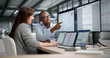 © Andrey Popov - Two Professionals Analyzing Financial Reports And Tracking Data