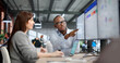 © Andrey Popov - Two Young Professionals Collaborate Using ERP And CRM Software