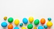 © Fatima - Numerous brightly dyed Easter eggs are scattered across a clean white.