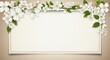 © fauziah - Floral frame with white blossoms and green leaves on a blank cream background