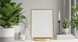 © Asif - Blank golden picture frame mockup with plants and candle