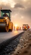 © Alina - Road roller paving asphalt at sunset. Fresh asphalt edge detail. Workers and machines on site. Road construction process. Infrastructure maintenance work.