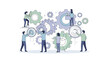 © Naswi - People working with large gears together.