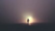 © Aisha - lonely figure walking on reflective ground towards a bright light in heavy purple fog
