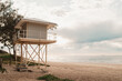 © Austockphoto - Lifeguard tower at the beach on peaceful morning with copy space