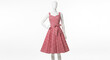 © Federico - A mannequin wearing a red and white gingham dress on display indoors.