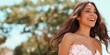 © Andrii Zastrozhnov - Female caucasian young laughing outdoors in strapless dress sunlit joyful portrait wavy brown hair carefree radiant summer breeze natural beauty