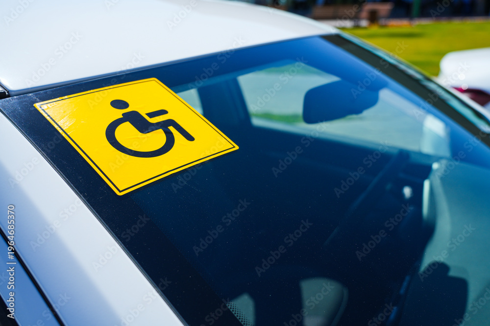 A sticker with the universal wheelchair symbol is glued to the rear ...