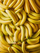 © Food Images - This image showcases a vibrant collection of ripe bananas arranged closely together