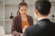 © aekachai - Professional Asian Businesswoman Conducting an Interview or Meeting in a Modern Office
