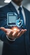© MdNazim - Businessman hand holding holographic document and shield in blue