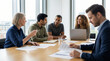 © AucArtStudio - Diverse team brainstorming startup project in modern office meeting room with focused discussion