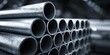 © Sulastri - Stacked metal pipes in a factory, close-up, industrial material