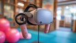 © Justlight - Pediatric VR game headset in crisp focus capturing interactive hand controllers with a blurred backdrop of a playful therapy space.