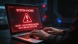 © Lee - System hacked alert on laptop screen with warning message cybersecurity breach detected unauthorized access notification hacker typing on keyboard in dark room data protection