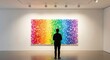 © Fitri - Man viewing large colorful art piece.