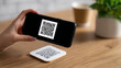 © Anastasiya Marchenko - Scanning QR code with smartphone device