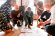 © Rawpixel.com - Collaborative team analyzing project documents.