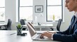 © MST. Anjumanara - Professional businesswoman working on laptop, corporate office interior, modern workspace desk