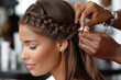 © YouraPechkin - Elegant hairstyling process at a salon with intricate braids and smooth finishes