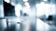 © Chandlerlikes - Blurred office interior with digital screens and modern desks, technology company background