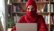 © SILVIA - Young Muslim Woman in Red Hijab Working on Laptop in a Book-Filled Room.