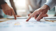 © iPhoto - Business Team Analyzing Data Charts in Office Meeting Close Up