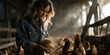 © butenkow - Young female farmer examining grain to ensure proper poultry nutrition and health