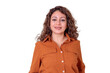 © Komora - Mature woman smiling, expressing confidence and approachability, wearing an orange shirt, isolated with transparent background