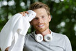 © auremar - portrait of sportsman with towel and headphones