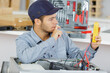 © auremar - an electrician repairing a machine